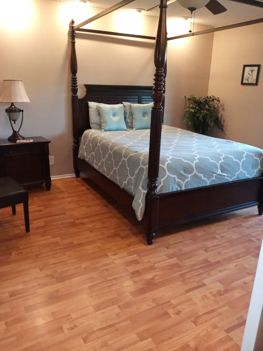 Bedroom dusted and wood floors gleaming